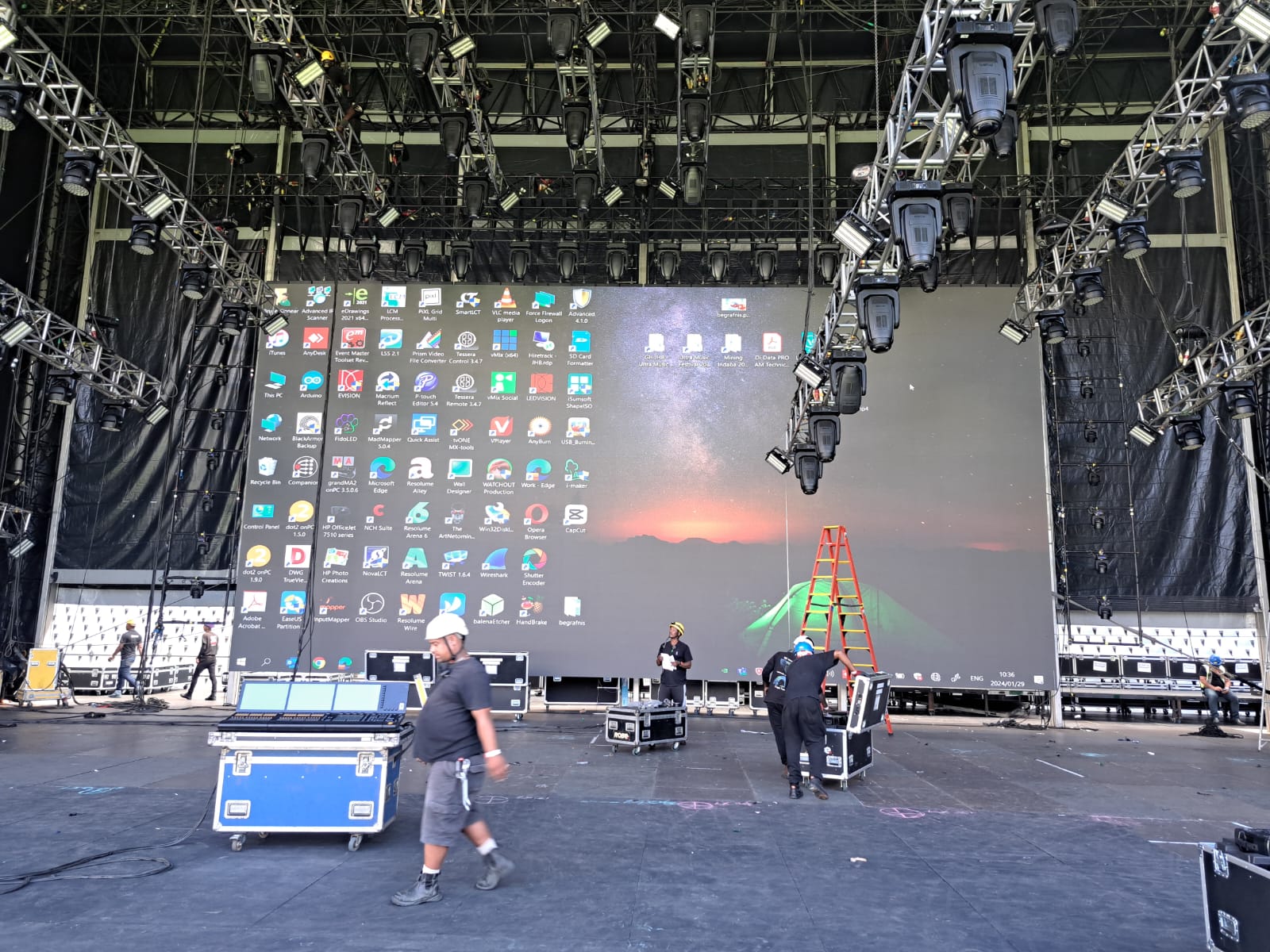 A large festival crowd gathered in front of the live stage